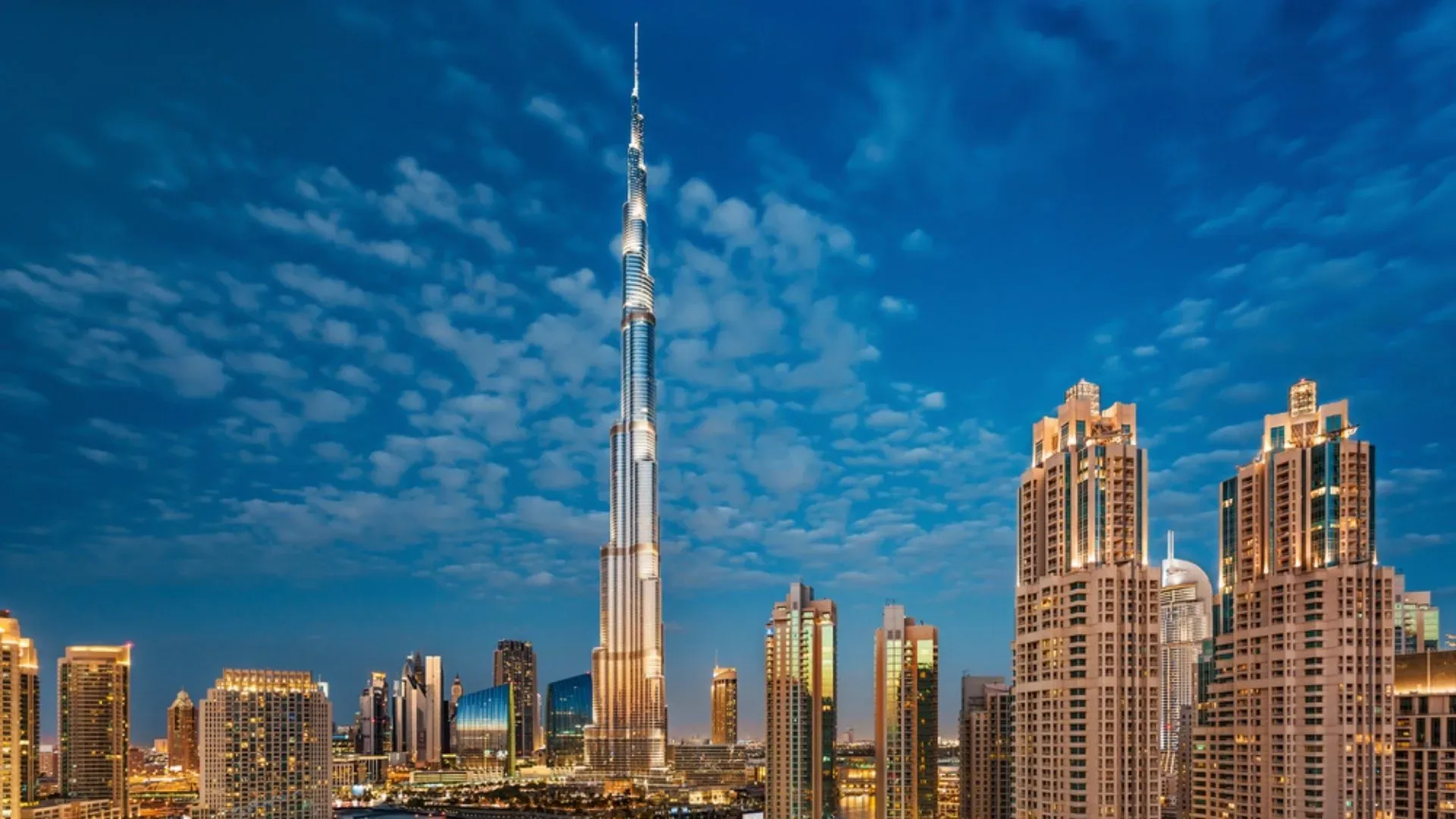 Burj Khalifa and the Downtown Dubai skyline under a blue sky