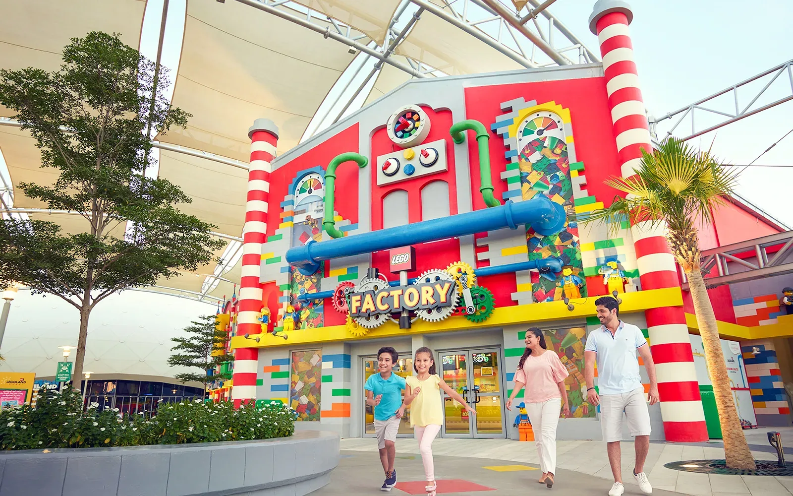 Family exploring the colourful LEGO Factory at LEGOLAND Dubai